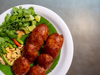 Thai northeastern style sausage with roasted beans fresh chilli and lime