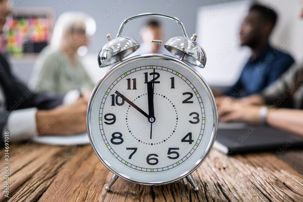 Wall mural close-up of alarm clock on desk