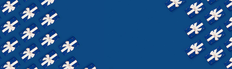 Celebration web-banner. Blue gift boxes on classic blue background. Flat lay, top view, copy space.