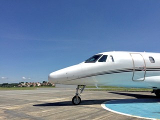 Obraz premium Private jet parked in airport yard preparing for boarding