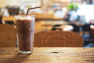 Iced Mocha coffee in glass on the wooden table