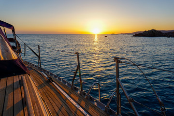 sailing yachts at sunset