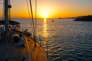 sailing yachts at sunset