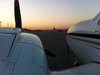 Fototapeta na wymiar Aircraft at an airport at sunset