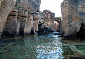 Ancient walls of a castle submerged in water © Elena