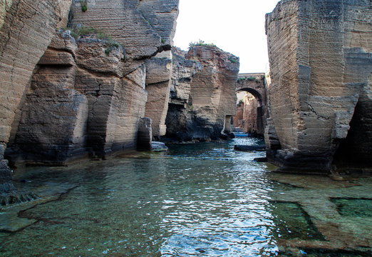 Ancient walls of a castle submerged in water