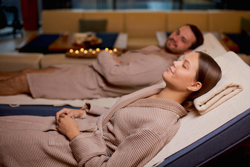 holiday, weekend of young happy couple taking rest together in spa salon, enjoy time in beauty salon, spa procedures