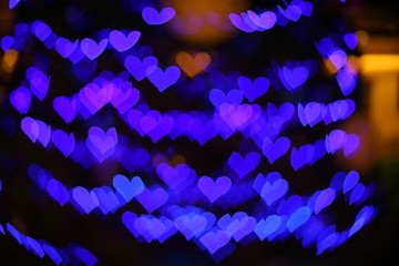 abstract image blur purple heart light of love used for wedding background