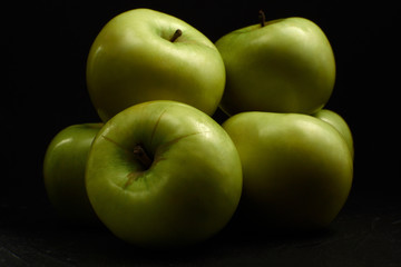 Green apples Simirenko at black background