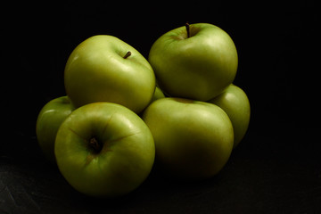 Green apples Simirenko at black background