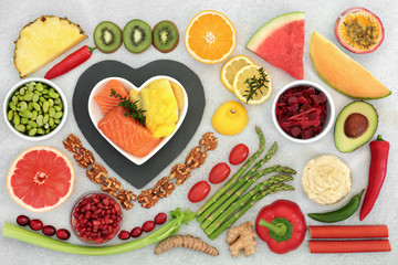 Healthy heart food collection with health foods high in fibre, antioxidants, vitamins, omega 3 and protein. Support for the cardiovascular system with low GI. Flat lay.