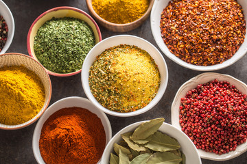 Set of variety aromatic spices and herbs in bowls