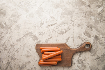 Close-up of sausages. Sausages on the blackboard and place for text. Boiled raw bavarian sausages and copy space.