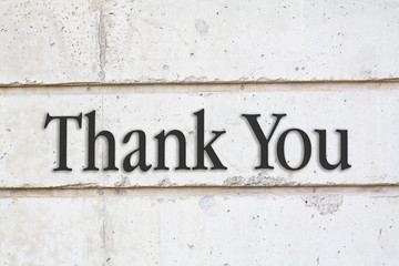 written Thank You words on concrete wall background