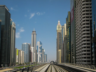 modern skyscrapers along the metro line in Dubai, UAE