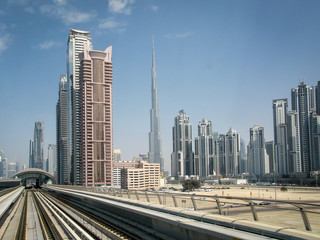 modern skyscrapers and Burdj-Halifa  along the metro line in Dubai, UAE