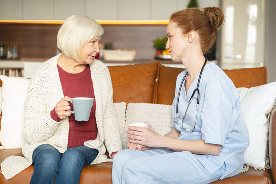 Positive Delighted Young Doctor Consulting Her Patient