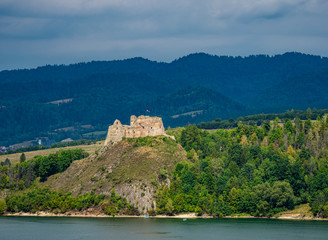 Fototapeta premium View over Lake Czorsztyn towards Czorsztyn Castle, Lesser Poland Voivodeship, Poland