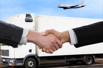 Businessman Shaking Hands In Front Of Mallet