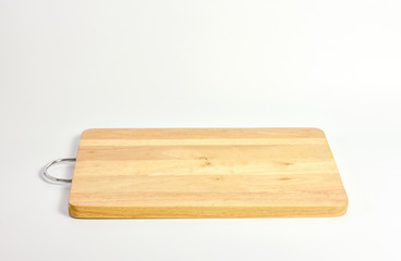 Wooden cutting board with metallic handle isolated on white