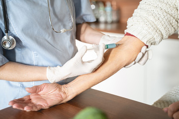 Close up of doctor that doing injection