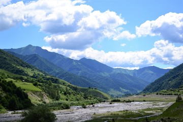 Naklejka na ściany i meble Gorge in the mountains of Georgia below the river.