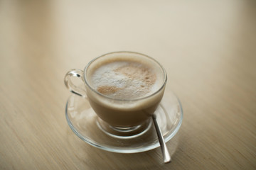 cup of coffee on wooden table