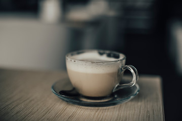 cup of coffee on wooden table