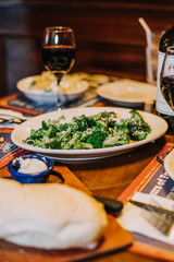 Food on a table with a glass of red wine, Italian cuisine, 