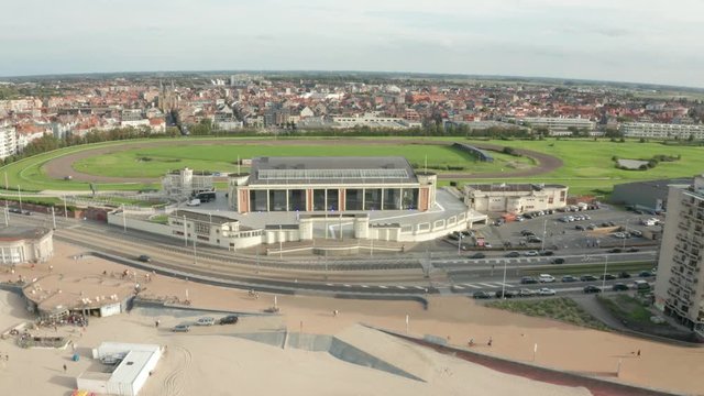 Aerial view of ostend with people biking and cars near beach coastline summer