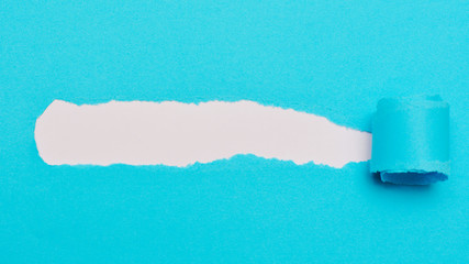 Blank blue pieces of torn paper. A space to write down a text.