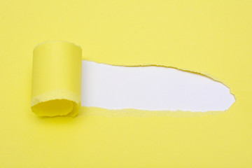 Blank yellow pieces of torn paper. A space to write down a text.