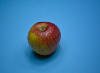 Fresh apple on blue background