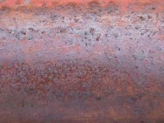 Rusted metal wall. Rusty metal background with streaks of rust.ancient.