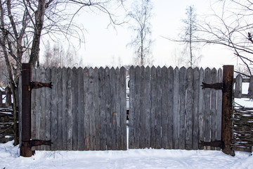 Gate from old planks with iron hinges
