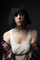 Naklejka premium Portrait of crying young woman in studio.