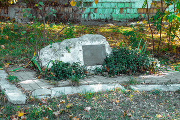 Old memorial stone with a blank sign for your text