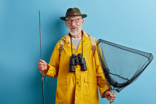 old cheerful man spending his holiday on fishing. close up photo. people, interets, hobby