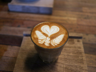 cup of coffee on wooden table