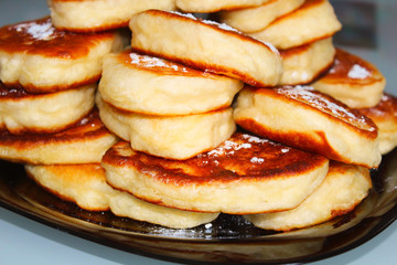 Russian homemade pancakes on a plate. Close-up. Background.