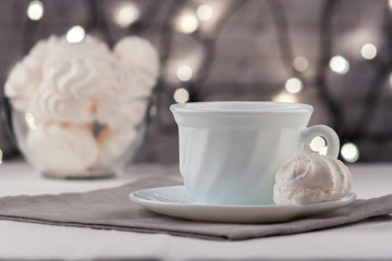 Cup of fresh aromatic coffee on a table with marmalade canapes