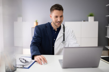 Man Working Two Jobs In Office