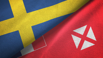 Sweden and Wallis and Futuna two flags textile cloth, fabric texture