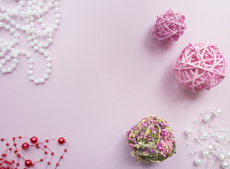 Creative designer balls on a pastel pink background. Flat lay.