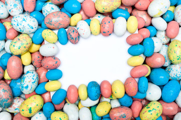 Fototapeta na wymiar Blank message card in candy easter eggs