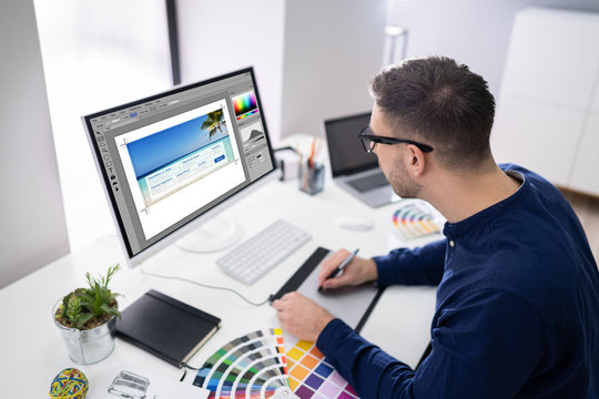 Male Designer Working On Computer