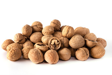 a large number of walnuts on a white background