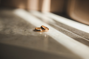 Wedding rings lie on the table