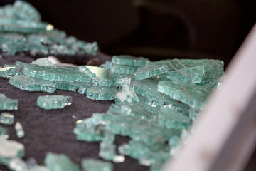 A closeup view of shards of glass from a broken windshield.