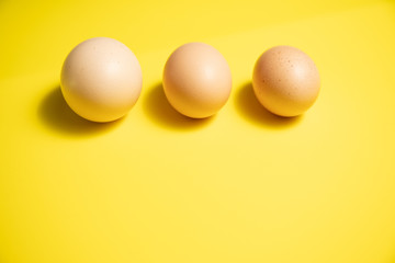 Fresh Easter Eggs on a Yellow Background. Happy Easter